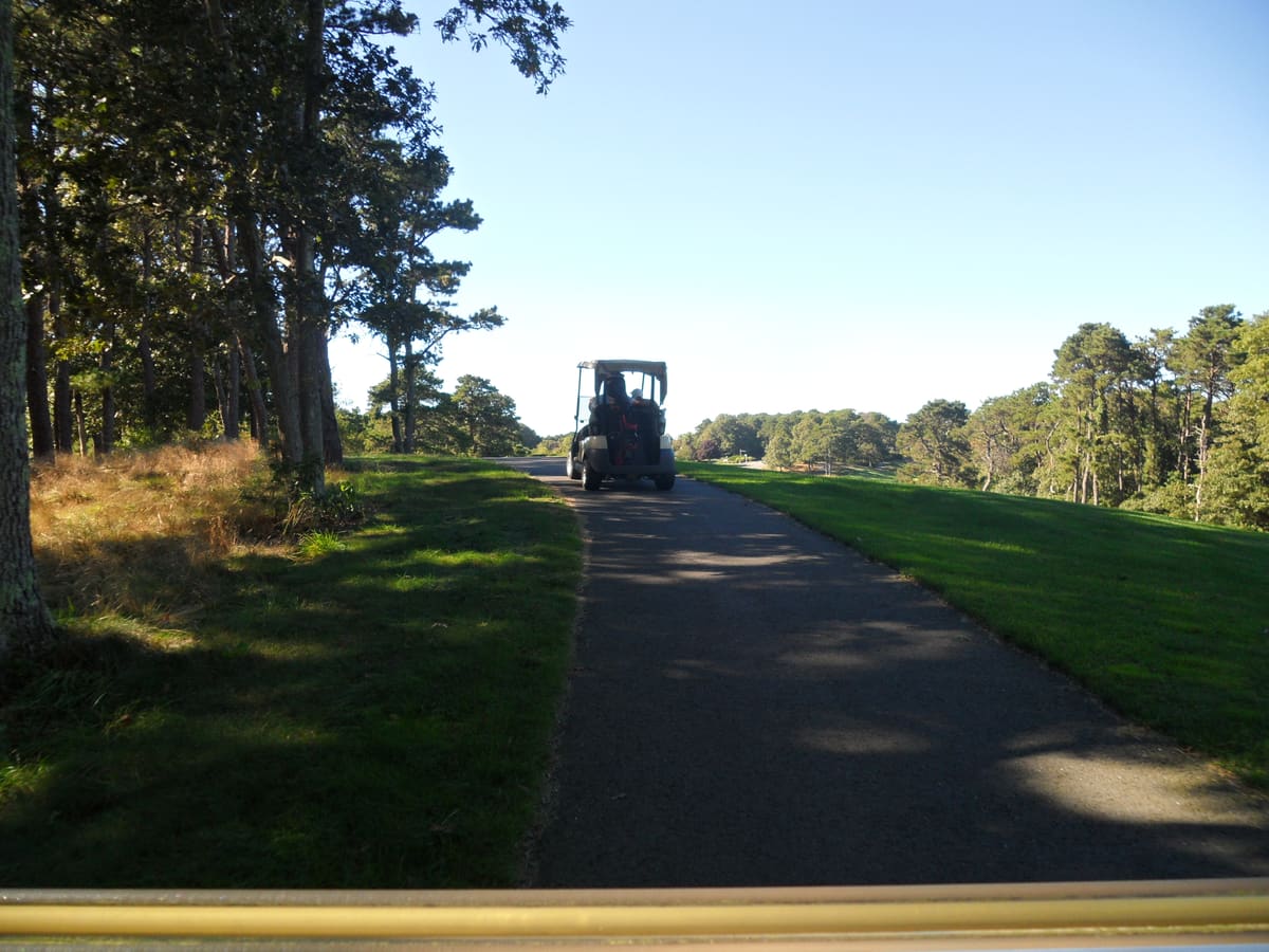 Cape Cod golf course fairway lined with pitch pine and oak trees - Bayberry Hills, Bass River, and Blue Rock are all within 4 miles