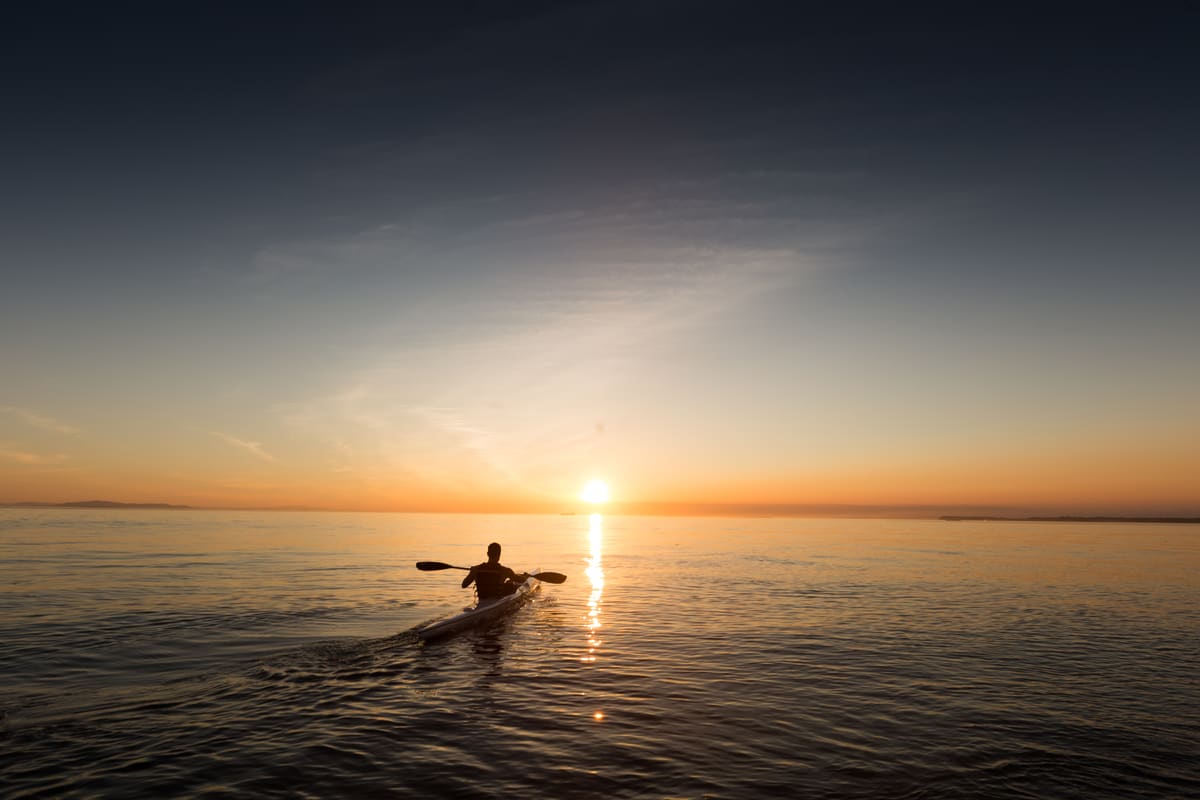 Kayaking at golden hour on calm Cape Cod waters - Lewis Bay is walking distance from Relax Inn