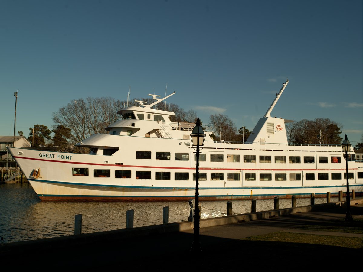 Hy-Line Great Point catamaran ferry underway in Hyannis Harbor at dusk