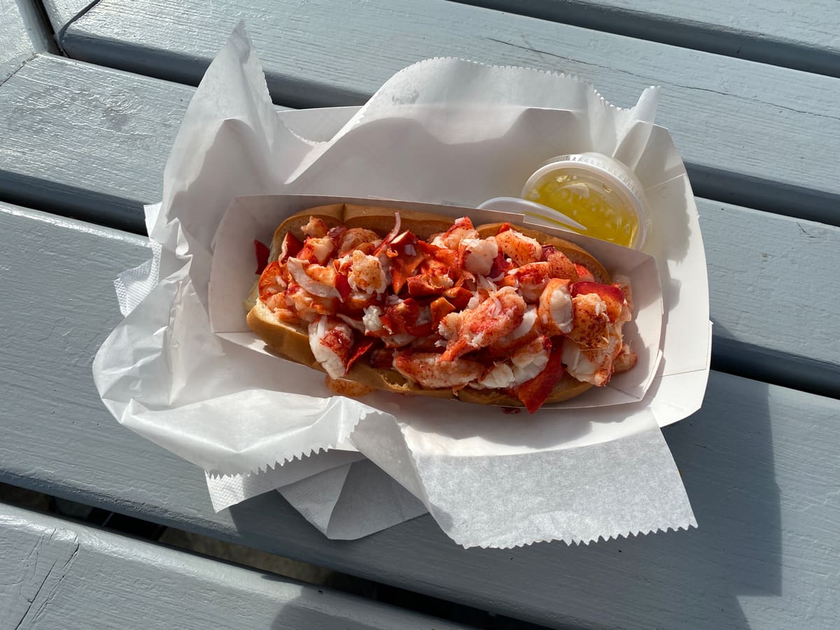 A classic New England lobster roll - fresh seafood dining is steps from every beach on Cape Cod