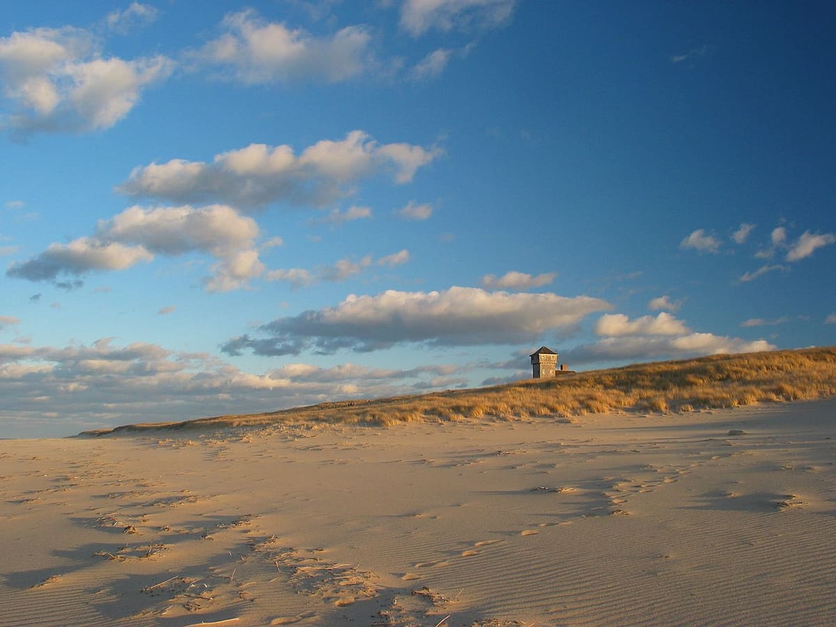 Cape Cod sand dunes at golden hour - outdoor adventure awaits whether sun or clouds